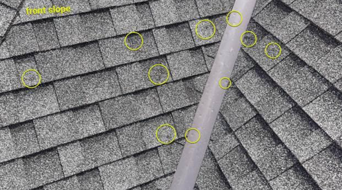 hail-damage-shingle-metal-valley-drone-capture.jpg